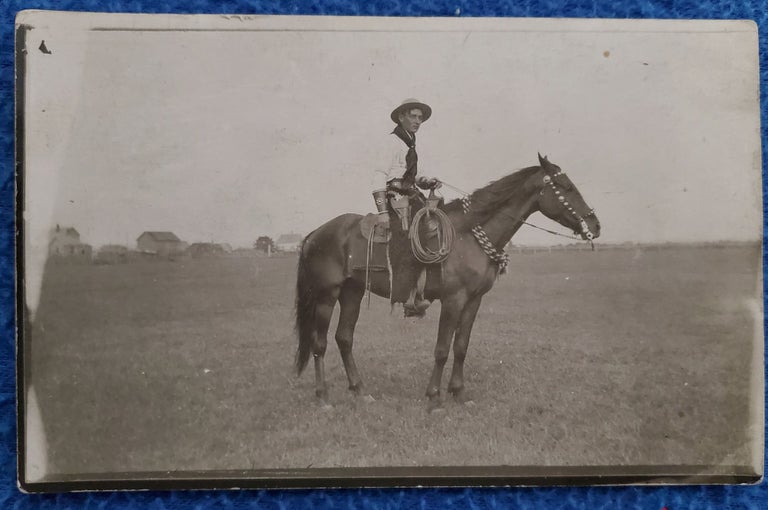 Item #2111065 ARMED COWBOY ON HORSE PHOTO. Photograph, Cowboy on horse.