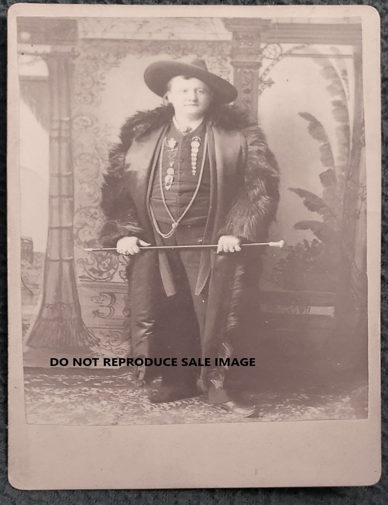 Item #2507058 UKNOWN CABINET CARD OF WELL-DRESSED MAN IN WESTERN GARB WITH BEAR OR BUFFALO COAT. Western Gent.